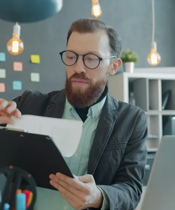 Advisor reviewing a client plan at his desk