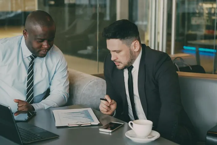 Two business leaders reviewing documents together